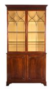 A MAHOGANY BOOKCASE CABINET IN GEORGE III STYLE