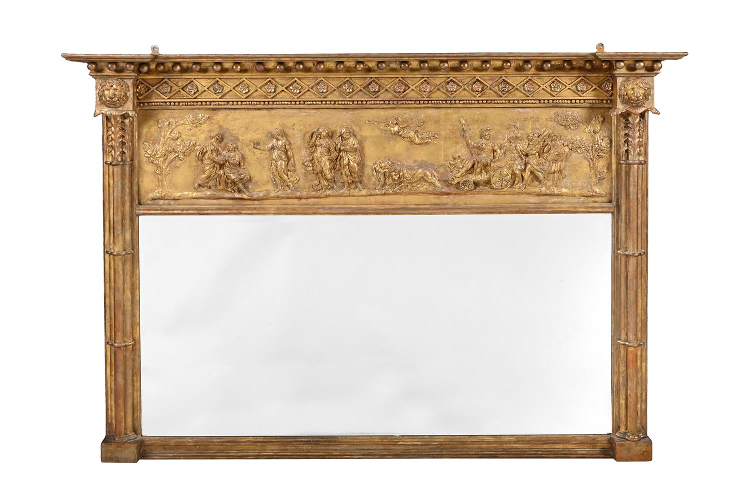 A REGENCY GILTWOOD AND COMPOSITION OVERMANTEL WALL MIRROR