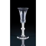 AN OPAQUE-TWIST ALE-FLUTETHIRD QUARTER 18TH CENTURYWith centrally knopped stem19cm highProvenanc