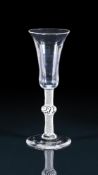 AN OPAQUE-TWIST ALE-FLUTETHIRD QUARTER 18TH CENTURYWith centrally knopped stem19cm highProvenanc