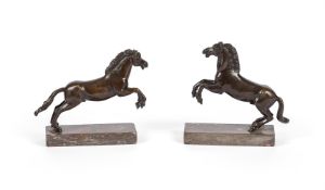 AFTER FRANCESCO FANELLI (1577-1657), A PAIR OF BRONZE FIGURES OF GALLOPING RAMPANT HORSES