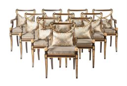 A SET OF TEN SIMULATED ROSEWOOD AND PARCEL GILT DINING CHAIRS IN REGENCY STYLE