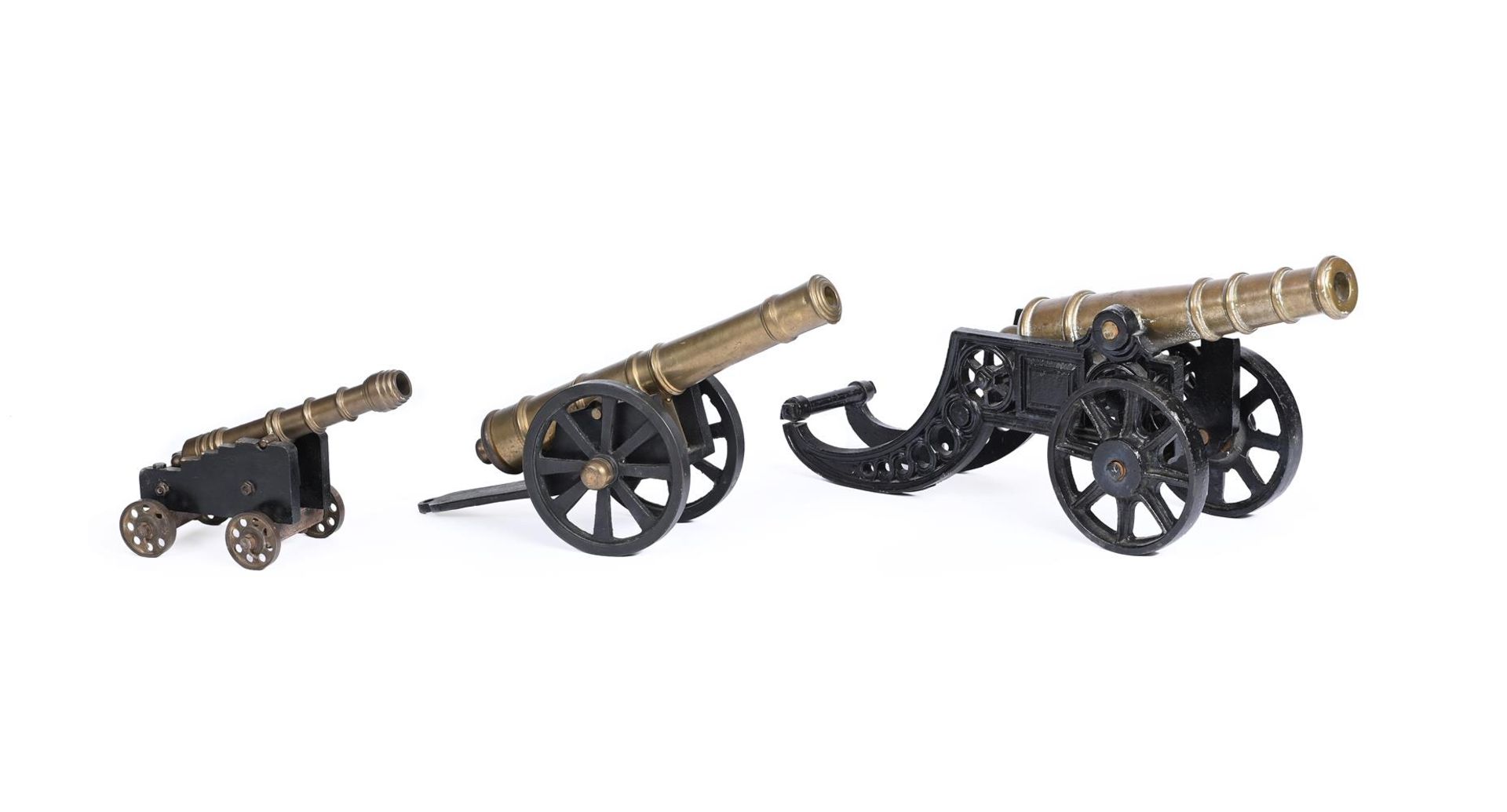 A GROUP OF THREE VARIOUS MODELS OF FIELD GUNS AND CANONS