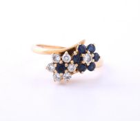 A SAPPHIRE AND DIAMOND DOUBLE FLOWER HEAD CLUSTER RING, LONDON 1980