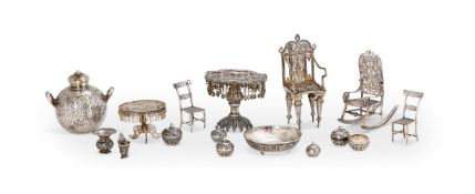 A COLLECTION OF SILVER COLOURED MINIATURE FURNITURE
