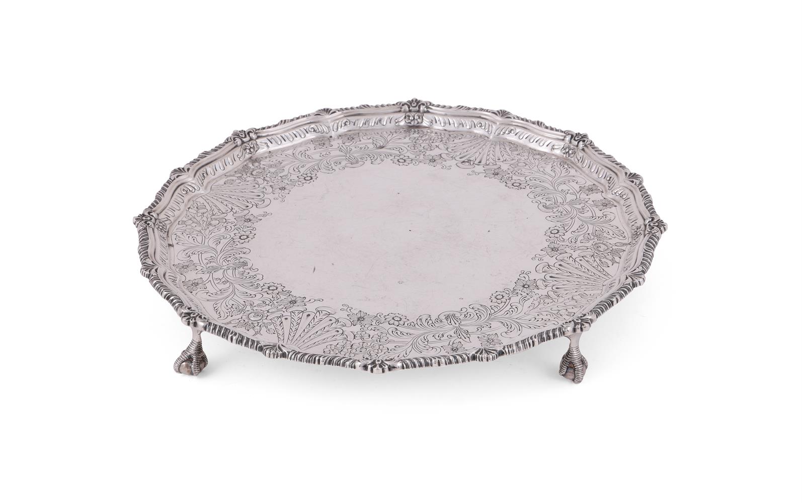 AN EDWARDIAN SILVER SHAPED CIRCULAR SALVER