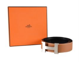 HERMÈS, A REVERSIBLE BROAD BLACK AND TAN LEATHER BELT WITH H BELT BUCKLE