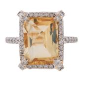 A CITRINE AND DIAMOND CLUSTER DRESS RING