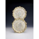 A PAIR OF GEORGE III SILVER GILT SALVERS