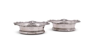 A PAIR OF VICTORIAN SILVER MOUNTED BOTTLE COASTERS
