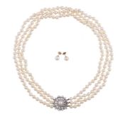 A THREE ROW CULTURED PEARL NECKLACE WITH DIAMOND AND PEARL CLASP
