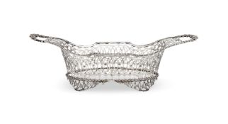 A CONTINENTAL SILVER TWIN HANDLED SHAPED OVAL PIERCED BASKET