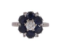 A SAPPHIRE AND DIAMOND CLUSTER RING, LONDON 1987