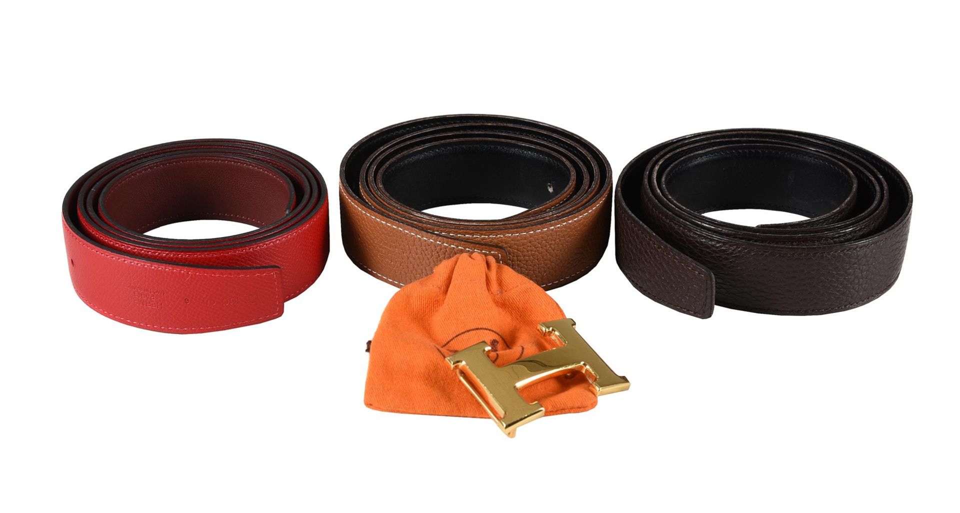 HERMÈS, THREE REVERSIBLE LEATHER BELTS WITH A H BELT BUCKLE