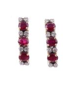 A PAIR OF DIAMOND AND RUBY EARRINGS