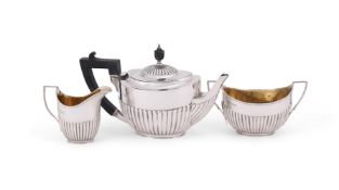 A VICTORIAN SILVER THREE PIECE OVAL TEA SET