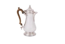 A SILVER BALUSTER HOT WATER POT