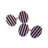 A PAIR OF BLUE ENAMELLED GOLD COLOURED CUFFLINKS