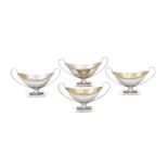 A SET OF FOUR VICTORIAN SILVER NAVETTE SHAPED SALTS