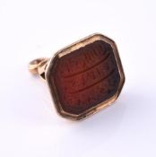 A LATE 18TH CENTURY GOLD AND CORNELIAN FOB SEAL INSCRIBED WITH ARABIC SCRIPT, CIRCA 1780