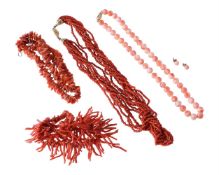 Y FOUR CORAL NECKLACES AND A PAIR OF CORAL STUDS