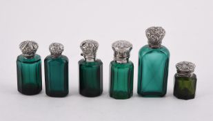 SIX GREEN GLASS FACETTED GLASS SCENT BOTTLES WITH WHITE METAL MOUNTS