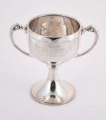 A SILVER TWIN HANDLED TROPHY CUP