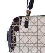CHRISTIAN DIOR, CANNAGE MARIS PEARL, A BLACK LEATHER AND FAUX FUR BAG