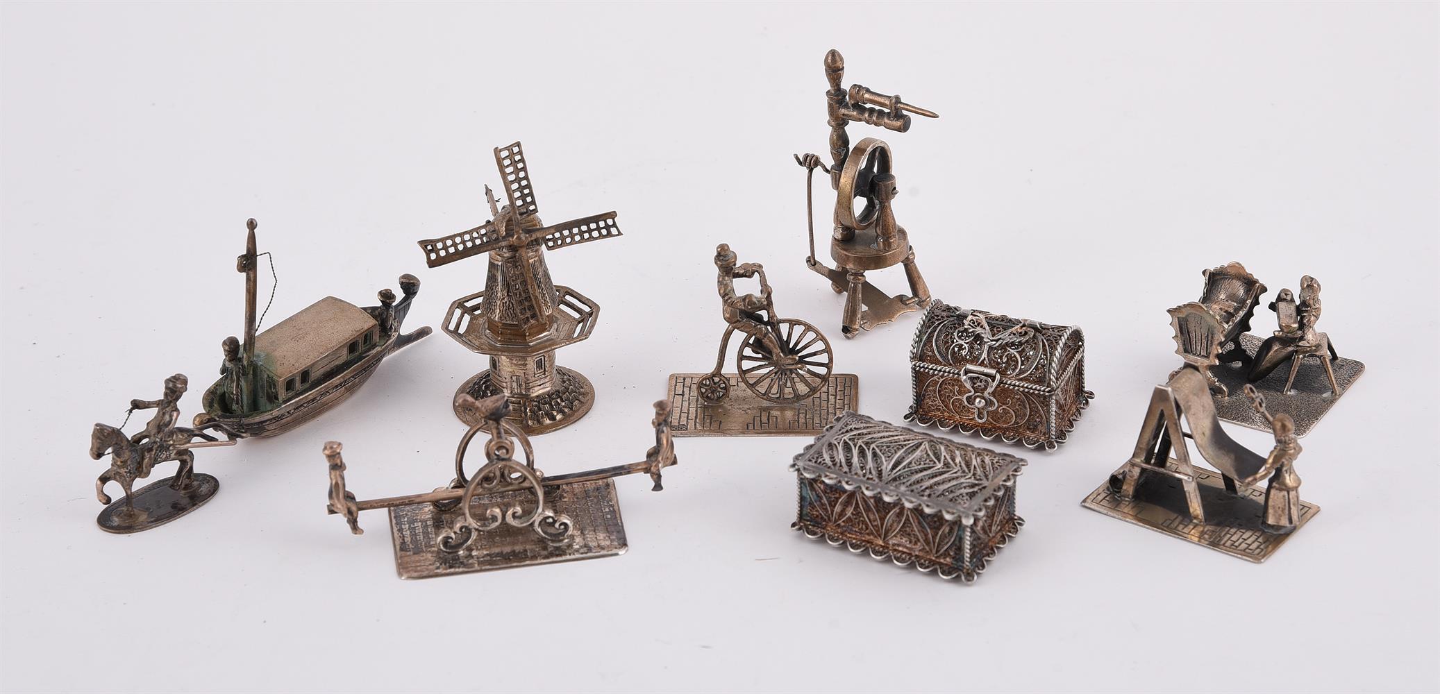 A COLLECTION OF MINIATURE SILVER MODELS