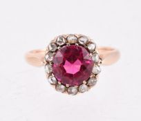 AN EARLY 20TH CENTURY SYNTHETIC RUBY AND DIAMOND RING