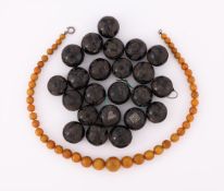 A COLLECTION OF VICTORIAN CARVED NUT BEADS