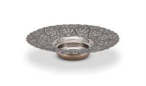 A SILVER COLOURED SHAPED CIRCULAR BOWL