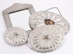 FOUR SILVER COLOURED MOUNTED MIRRORS