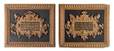A PAIR OF ENGLISH CARVED AND PAINTED STRAPWORK FRAMED PSALMS, 17TH CENTURY