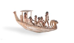 AN EGYPTIAN WOOD FUNERARY BOAT WITH CREW, MIDDLE KINGDOM, CIRCA 2133-1797 B.C.