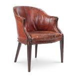 A GEORGE III MAHOGANY AND LEATHER LIBRARY ARMCHAIR CIRCA 1780