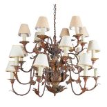 A GILT TOLE PEINTE SIXTEEN LIGHT CHANDELIER ITALIAN