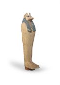 AN EGYPTIAN WOOD FUNERARY FIGURE OF JACKAL HEADED DUAMUTEF, CIRCA 400-30 B.C.