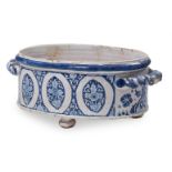 A FRENCH FAIENCE TWO HANDLED JARDINIERE OR CISTERN PROBABLY ROUEN, 18TH CENTURY