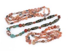 TWO RE-STRUNG NECKLACES COMPOSED OF ‘ETCHED’ CARNELIAN BEADS CIRCA 2ND B.C. - 1ST MILLENNIUM A.D.