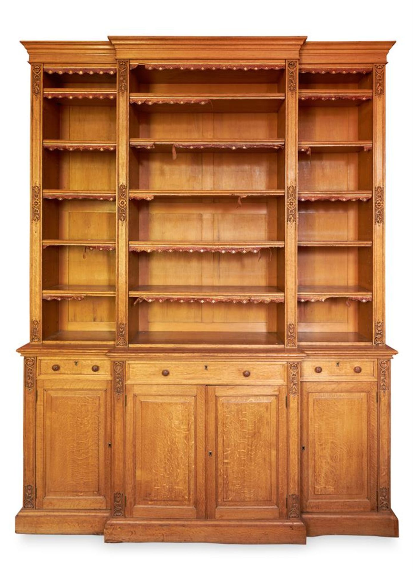 A VICTORIAN OAK BREAKFRONT BOOKCASE, THIRD QUARTER 19TH CENTURY