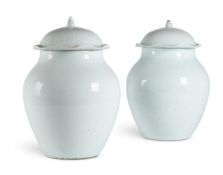 A PAIR OF WHITE GLAZED VASES AND COVERSIN QINGBAI STYLE