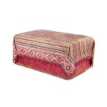 A TEXTILE COVERED OTTOMAN BY ROBERT KIME