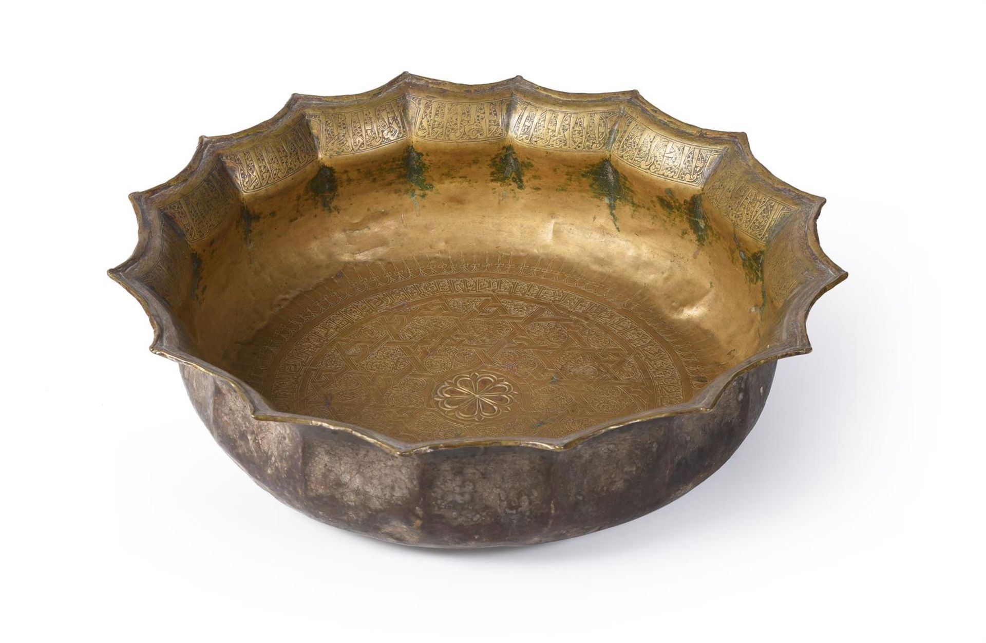 A MAMLUK ENGRAVED BRASS BASIN, EGYPT OR SYRIA, CIRCA 14TH CENTURY