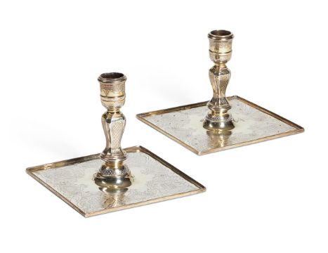 A MATCHED PAIR OF GEORGE II SILVER-GILT CANDLESTICKS