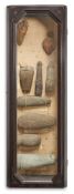 A GLAZED FRAMED CASE CONTAINING FLINT HAND AXES AND STONE AXES, CIRCA 2000 B.C. AND EARLIER