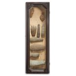 A GLAZED FRAMED CASE CONTAINING FLINT HAND AXES AND STONE AXES, CIRCA 2000 B.C. AND EARLIER