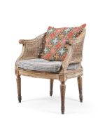 A LOUIS XVI PAINTED WALNUT BERGERE ARMCHAIR, LATE 18TH CENTURY