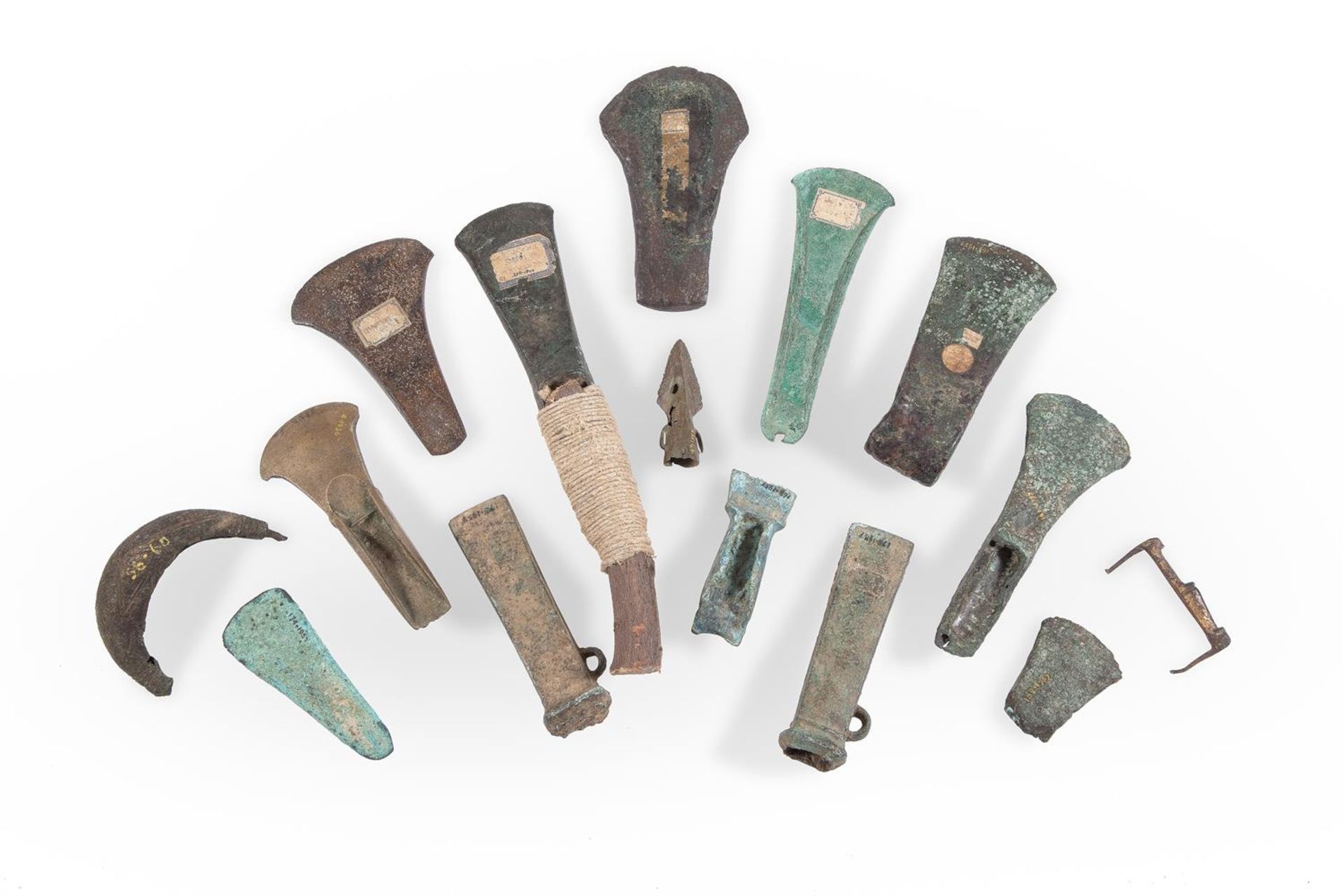 A COLLECTION OF FIFTEEN BRONZE AGE AXES, CIRCA 1500-800 B.C.