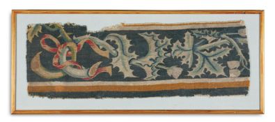 A TAPESTRY BORDER FRAGMENT WITH THISTLES AND RIBBONS, PROBABLY 17TH CENTURY